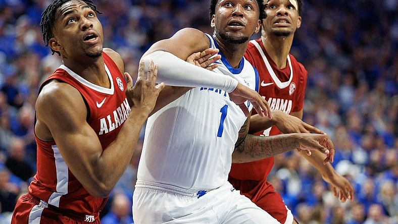 Feb 24, 2024; Lexington, Kentucky, USA; Kentucky Wildcats guard Justin Edwards (1) jostles for position under the basket as a teammate shoots a free throw during the second half against the Alabama Crimson Tide at Rupp Arena at Central Bank Center. Mandatory Credit: Jordan Prather-USA TODAY Sports