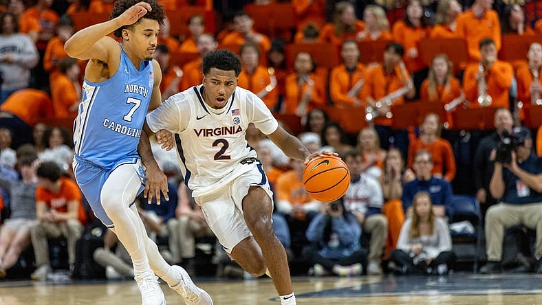 Feb 24, 2024; Charlottesville, Virginia, USA; Virginia Cavaliers guard Reece Beekman (2) drives to the basket while North Carolina Tar Heels guard Seth Trimble (7) defends during the second half at John Paul Jones Arena. Mandatory Credit: Hannah Pajewski-USA TODAY Sports