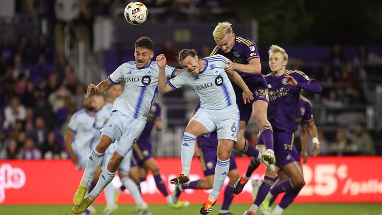 Feb 24, 2024; Orlando, Florida, USA; CF Montreal midfielder Dominic Iankov (8) CF Montreal midfielder Samuel Piette (6) battle Orlando City defender Robin Jansson (6) for the ball in the first half at Inter&Co Stadium. Mandatory Credit: Morgan Tencza-USA TODAY Sports