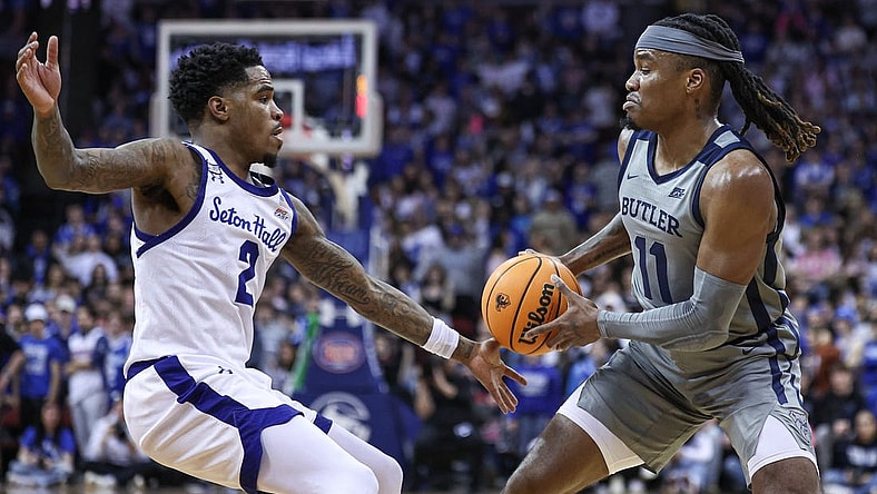 Feb 24, 2024; Newark, New Jersey, USA; Butler Bulldogs guard Jahmyl Telfort (11) looks to pass was Seton Hall Pirates guard Al-Amir Dawes (2) defends during the first half at Prudential Center. Mandatory Credit: Vincent Carchietta-USA TODAY Sports