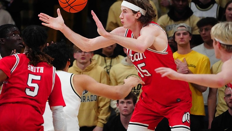 Feb 24, 2024; Boulder, Colorado, USA; Utah Utes center Branden Carlson (35) reaches for a loose ball in the first half against the Colorado Buffaloes at the CU Events Center. Mandatory Credit: Ron Chenoy-USA TODAY Sports