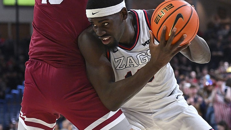 Feb 24, 2024; Spokane, Washington, USA; Gonzaga Bulldogs forward Graham Ike (13) fights for position against Santa Clara Broncos center Francisco Caffaro (10) in the second half at McCarthey Athletic Center. Gonzaga Bulldogs won 94-81. Mandatory Credit: James Snook-USA TODAY Sports