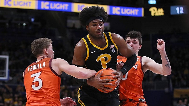 Pittsburgh Panthers Blake Hinson (2) gets fouled by Virginia Tech Hokies Sean Pedulla (3) while going for a layup during the first half on February 24, 2024 at the Petersen Events Center in Pittsburgh, PA.