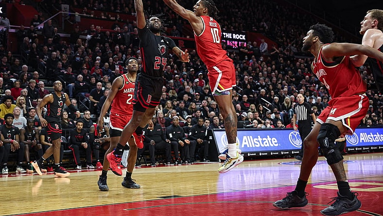 Feb 25, 2024; Piscataway, New Jersey, USA; Maryland Terrapins forward Julian Reese (10) blocks a shot by Rutgers Scarlet Knights guard Austin Williams (24) during the second half at Jersey Mike's Arena. Mandatory Credit: Vincent Carchietta-USA TODAY Sports