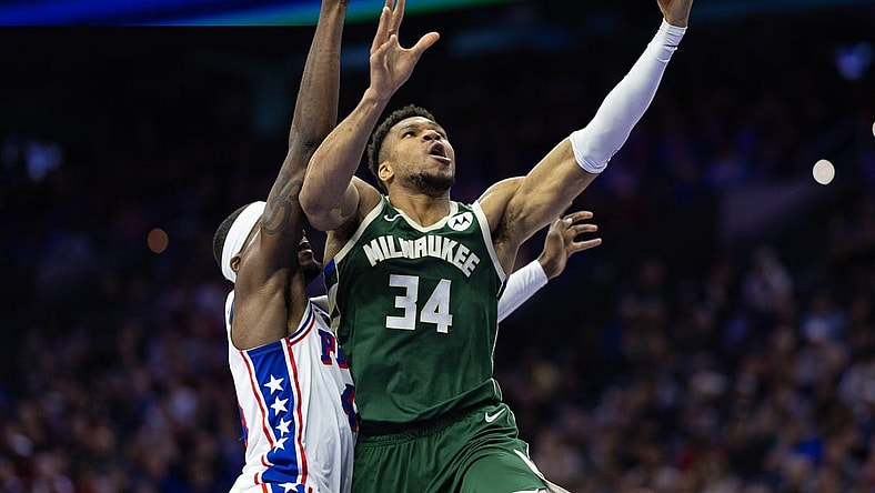 Feb 25, 2024; Philadelphia, Pennsylvania, USA; Milwaukee Bucks forward Giannis Antetokounmpo (34) drives for a score past Philadelphia 76ers forward Paul Reed (44) during the second quarter at Wells Fargo Center. Mandatory Credit: Bill Streicher-USA TODAY Sports