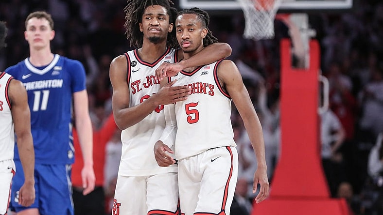 Feb 25, 2024; New York, New York, USA;  St. John's Red Storm forward Glenn Taylor Jr. (35) hugs guard Daniss Jenkins (5) in the second half against the Creighton Bluejays at Madison Square Garden. Mandatory Credit: Wendell Cruz-USA TODAY Sports