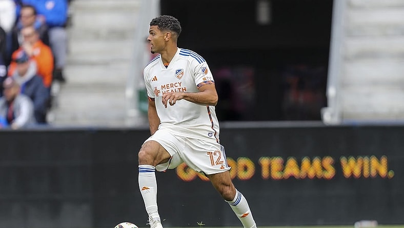 Feb 25, 2024; Cincinnati, Ohio, USA; FC Cincinnati defender Miles Robinson (12) dribbles against Toronto FC in the first half at TQL Stadium. Mandatory Credit: Katie Stratman-USA TODAY Sports