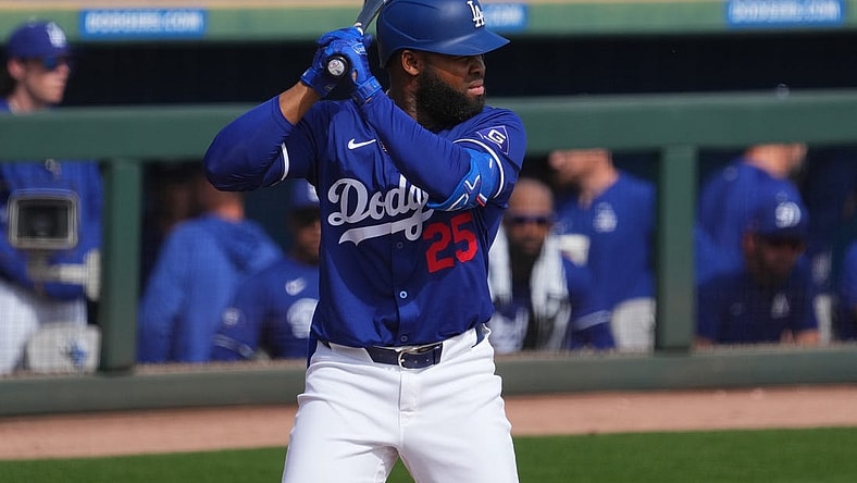 Feb 25, 2024; Phoenix, Arizona, USA; Los Angeles Dodgers designated hitter Manuel Margot (25) bats against the Oakland Athletics during the third inning at Camelback Ranch-Glendale. Mandatory Credit: Joe Camporeale-USA TODAY Sports