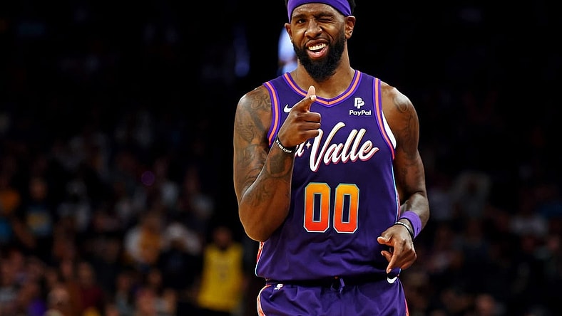 Feb 25, 2024; Phoenix, Arizona, USA; Phoenix Suns forward Royce O'Neale (00) reacts after a play during the second quarter of the game against the Los Angeles Lakers at Footprint Center. Mandatory Credit: Mark J. Rebilas-USA TODAY Sports