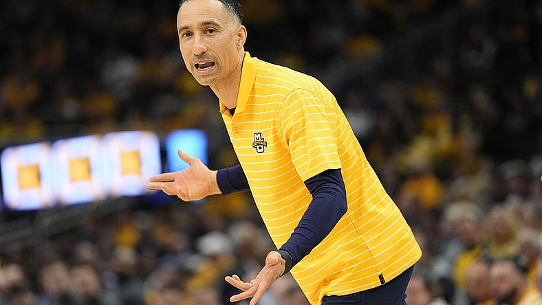 Feb 25, 2024; Milwaukee, Wisconsin, USA;  Marquette Golden Eagles head coach Shaka Smart reacts to a call during the first half against the Xavier Musketeers at Fiserv Forum. Mandatory Credit: Jeff Hanisch-USA TODAY Sports