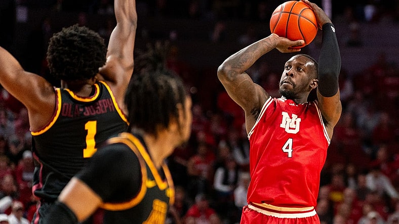 Feb 25, 2024; Lincoln, Nebraska, USA; Nebraska Cornhuskers forward Juwan Gary (4) shoots the ball against Minnesota Golden Gophers forward Joshua Ola-Joseph (1) and guard Elijah Hawkins (0) during the first half at Pinnacle Bank Arena. Mandatory Credit: Dylan Widger-USA TODAY Sports