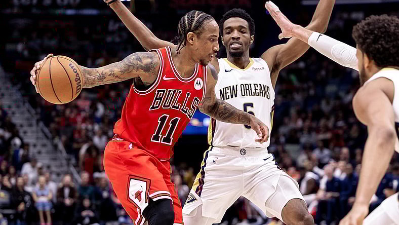 Feb 25, 2024; New Orleans, Louisiana, USA;  Chicago Bulls forward DeMar DeRozan (11) looks to pass the ball against New Orleans Pelicans forward Herbert Jones (5) during the second half at Smoothie King Center. Mandatory Credit: Stephen Lew-USA TODAY Sports