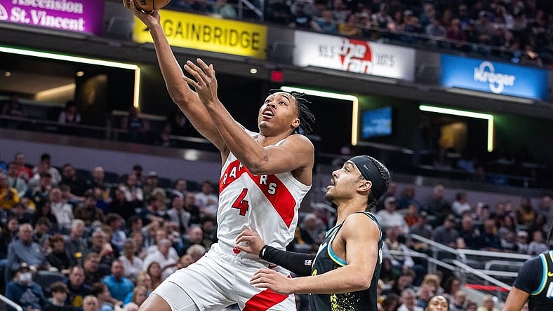 Feb 26, 2024; Indianapolis, Indiana, USA; Toronto Raptors forward Scottie Barnes (4) shoots the ball while Indiana Pacers guard Andrew Nembhard (2) defends in the first half at Gainbridge Fieldhouse. Mandatory Credit: Trevor Ruszkowski-USA TODAY Sports