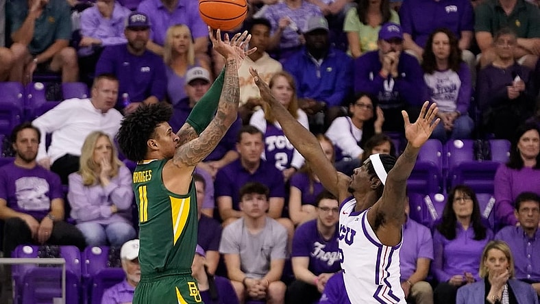 Feb 26, 2024; Fort Worth, Texas, USA; Baylor Bears forward Jalen Bridges (11) shoots over TCU Horned Frogs forward Emanuel Miller (2) during the first half at Ed and Rae Schollmaier Arena. Mandatory Credit: Raymond Carlin III-USA TODAY Sports