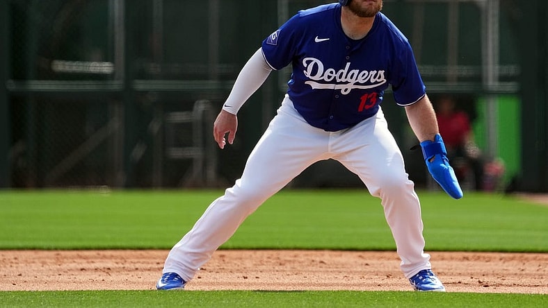 Feb 27, 2024; Phoenix, Arizona, USA; Los Angeles Dodgers third baseman Max Muncy (13) leads off first base during the first inning at Camelback Ranch-Glendale. Mandatory Credit: Joe Camporeale-USA TODAY Sports