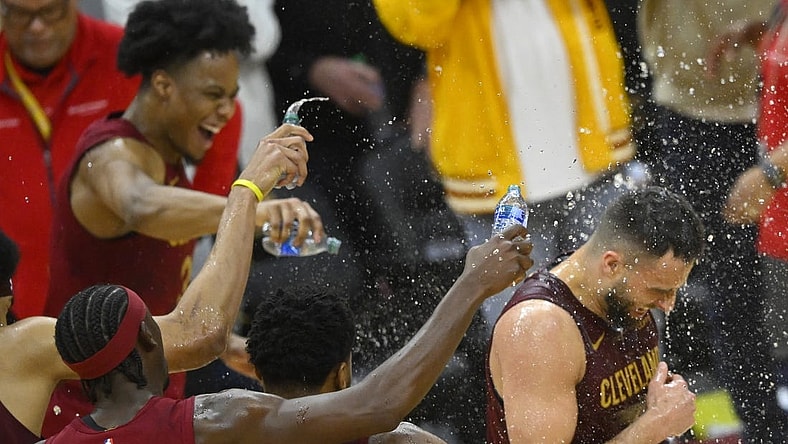 Feb 27, 2024; Cleveland, Ohio, USA; Cleveland Cavaliers guard Max Strus (1) is doused with water after hitting a last-second, game-winning three-point basket in the fourth quarter against the Dallas Mavericks at Rocket Mortgage FieldHouse. Mandatory Credit: David Richard-USA TODAY Sports