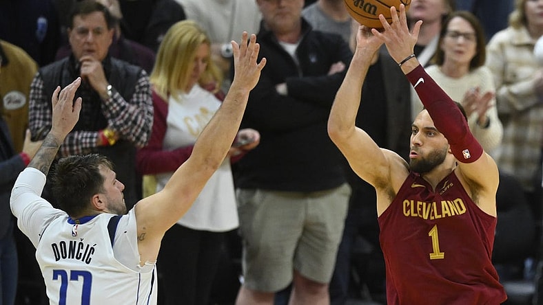 Feb 27, 2024; Cleveland, Ohio, USA; Cleveland Cavaliers guard Max Strus (1) makes a last-second, game-winning three-point basket beside Dallas Mavericks guard Luka Doncic (77) in the fourth quarter against at Rocket Mortgage FieldHouse. Mandatory Credit: David Richard-USA TODAY Sports