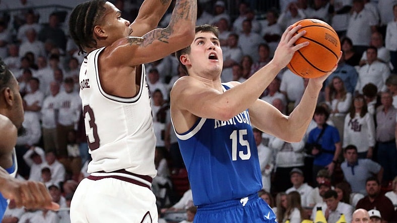 Feb 27, 2024; Starkville, Mississippi, USA; Kentucky Wildcats guard Reed Sheppard (15) drives to the basket as Mississippi State Bulldogs guard Shakeel Moore (3) defends during the second half at Humphrey Coliseum. Mandatory Credit: Petre Thomas-USA TODAY Sports