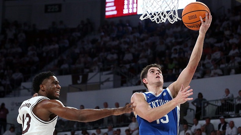 Feb 27, 2024; Starkville, Mississippi, USA; Kentucky Wildcats guard Reed Sheppard (15) drives to the basket as Mississippi State Bulldogs guard Josh Hubbard (13) defends during the second half at Humphrey Coliseum. Mandatory Credit: Petre Thomas-USA TODAY Sports