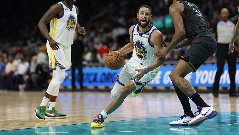 Feb 27, 2024; Washington, District of Columbia, USA; Golden State Warriors guard Stephen Curry (30) drives to the basket as Washington Wizards forward Marvin Bagley III (35) defends in the second half at Capital One Arena. Mandatory Credit: Geoff Burke-USA TODAY Sports