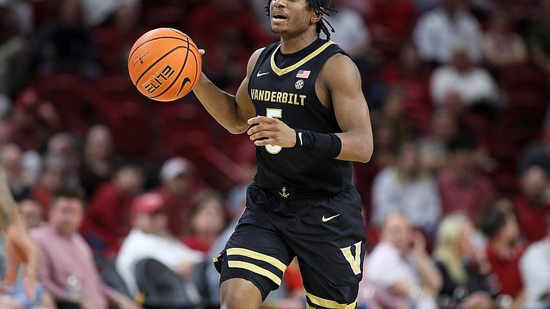 Feb 27, 2024; Fayetteville, Arkansas, USA; Vanderbilt Commodores guard Ezra Manjon (5) brings the ball up court during the first half against the Arkansas Razorbacks at Bud Walton Arena. Mandatory Credit: Nelson Chenault-USA TODAY Sports