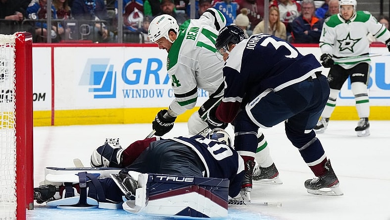 Feb 27, 2024; Denver, Colorado, USA; Dallas Stars left wing Jamie Benn (14) attempts to score on Colorado Avalanche goaltender Alexandar Georgiev (40) and defenseman Jack Johnson (3) in the first period at Ball Arena. Mandatory Credit: Ron Chenoy-USA TODAY Sports