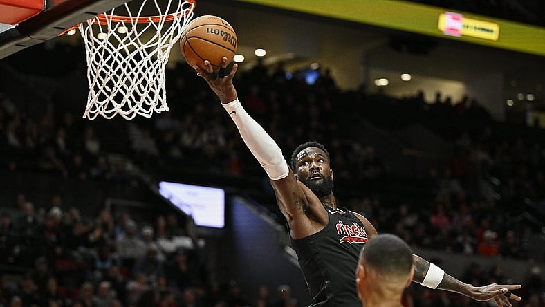 Feb 27, 2024; Portland, Oregon, USA; Portland Trail Blazers center Deandre Ayton (2) scores a basket during the first half against Miami Heat forward Kevin Love (42) at Moda Center. Mandatory Credit: Troy Wayrynen-USA TODAY Sports