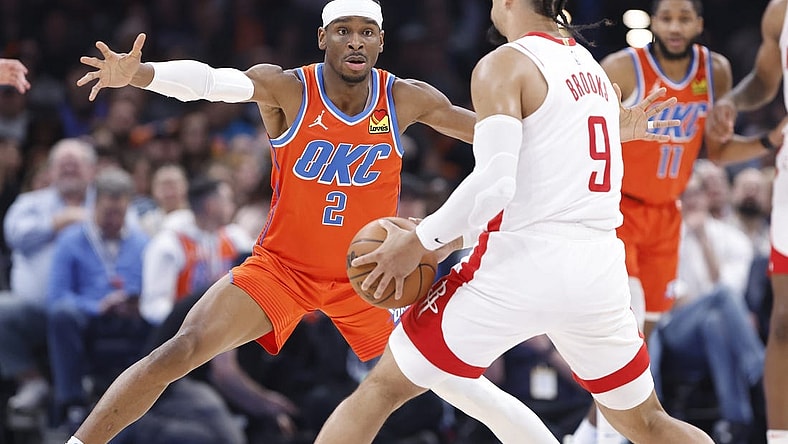 Feb 27, 2024; Oklahoma City, Oklahoma, USA; Oklahoma City Thunder guard Shai Gilgeous-Alexander (2) defends Houston Rockets forward Dillon Brooks (9) during the second quarter at Paycom Center. Mandatory Credit: Alonzo Adams-USA TODAY Sports