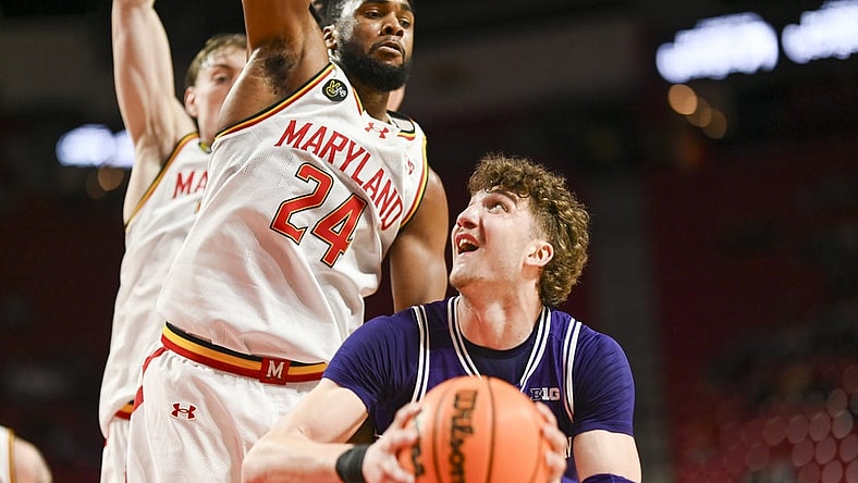 Feb 28, 2024; College Park, Maryland, USA; Northwestern Wildcats forward Nick Martinelli (2) looks to shoot as Maryland Terrapins forward Donta Scott (24) defends during the fist half at Xfinity Center. Mandatory Credit: Tommy Gilligan-USA TODAY Sports