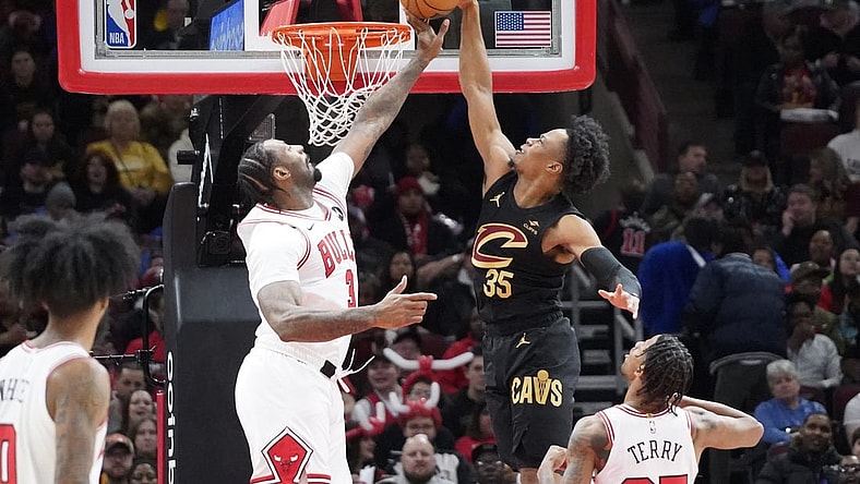 Feb 28, 2024; Chicago, Illinois, USA; Chicago Bulls center Andre Drummond (3) defends Cleveland Cavaliers forward Isaac Okoro (35) during the first quarter at United Center. Mandatory Credit: David Banks-USA TODAY Sports