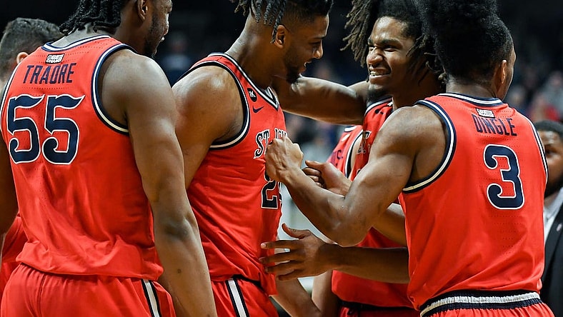 Feb 28, 2024; Indianapolis, Indiana, USA; St. John's Red Storm forward Zuby Ejiofor (24) and St. John's Red Storm forward Glenn Taylor Jr. (35) celebrate during a timeout against the Butler Bulldogs during the first half at Hinkle Fieldhouse. Mandatory Credit: Robert Goddin-USA TODAY Sports