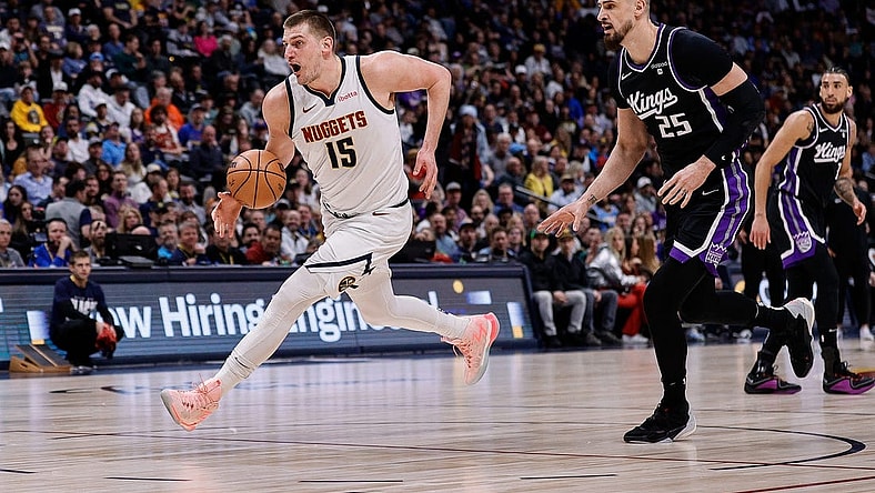 Feb 28, 2024; Denver, Colorado, USA; Denver Nuggets center Nikola Jokic (15) controls the ball ahead of Sacramento Kings center Alex Len (25) in the first quarter at Ball Arena. Mandatory Credit: Isaiah J. Downing-USA TODAY Sports