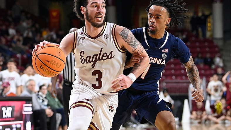 Feb 28, 2024; Chestnut Hill, Massachusetts, USA; Boston College Eagles guard Jaeden Zackery (3) drives the ball against Virginia Cavaliers guard Dante Harris (1) during the second half at Conte Forum. Mandatory Credit: Eric Canha-USA TODAY Sports