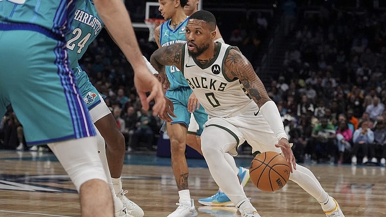 Feb 29, 2024; Charlotte, North Carolina, USA; Milwaukee Bucks guard Damian Lillard (0) moves to the basket against the Charlotte Hornets during the second quarter at Spectrum Center. Mandatory Credit: Jim Dedmon-USA TODAY Sports