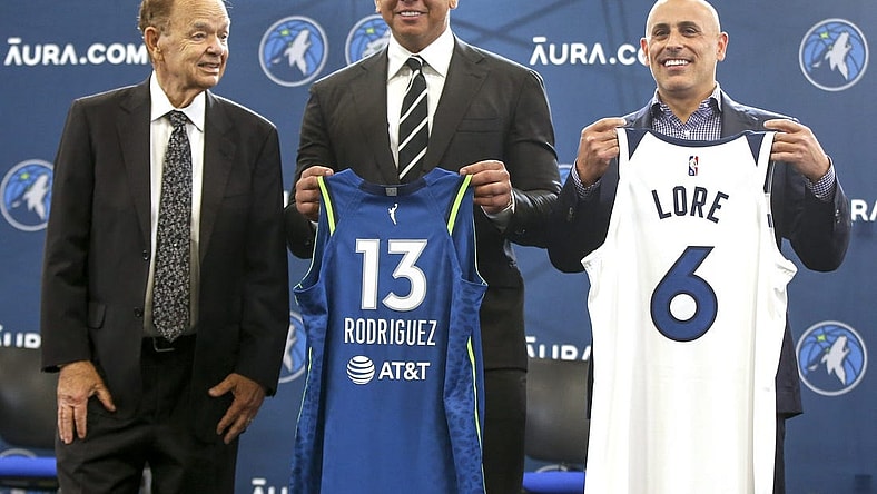Sep 27, 2021; Minneapolis, MN, USA; Current owner Glen Taylor and limited partners and alt-governors for the Minnesota Timberwolves Alex Rodriguez and Mark Lore hold up jerseys after answering questions at a press conference at media day. Mandatory Credit: Bruce Kluckhohn-USA TODAY Sports