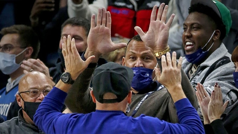 Oct 25, 2021; Minneapolis, Minnesota, USA; Minnesota Timberwolves minority owners Alex Rodriguez and Marc Lore cheer their team on in the third quarter against the New Orleans Pelicans at Target Center. Mandatory Credit: Bruce Kluckhohn-USA TODAY Sports