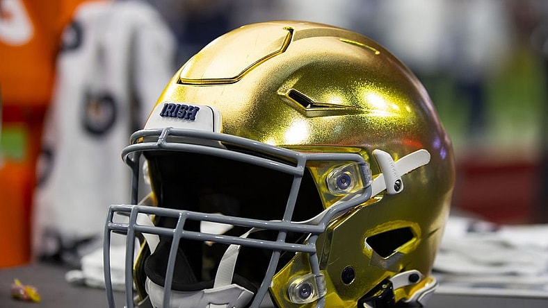 Jan 1, 2022; Glendale, Arizona, USA; Detailed view of a gold Notre Dame Fighting Irish helmet during the 2022 Fiesta Bowl at State Farm Stadium. Mandatory Credit: Mark J. Rebilas-USA TODAY Sports