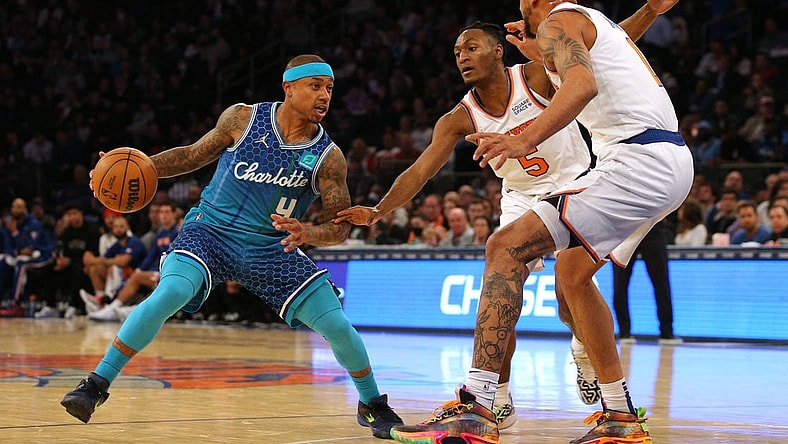 Mar 30, 2022; New York, New York, USA; Charlotte Hornets guard Isaiah Thomas (4) controls the ball against New York Knicks guard Immanuel Quickley (5) and forward Obi Toppin (1) during the second quarter at Madison Square Garden. Mandatory Credit: Brad Penner-USA TODAY Sports