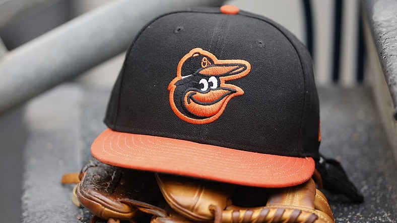 May 14, 2022; Detroit, Michigan, USA;  Baltimore Orioles cap and glove sits in dugout in the second inning against the Detroit Tigers at Comerica Park. Mandatory Credit: Rick Osentoski-USA TODAY Sports