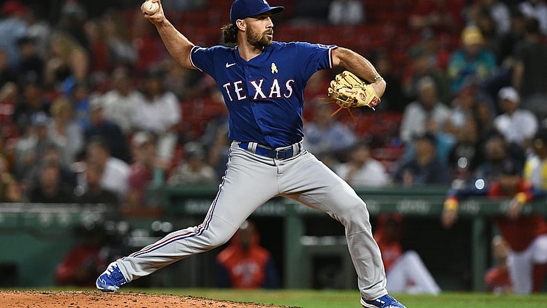 Sep 2, 2022; Boston, Massachusetts, USA; Texas Rangers third baseman Charlie Culberson (11) pitches against the Boston Red Sox during the eighth inning at Fenway Park. Mandatory Credit: Brian Fluharty-USA TODAY Sports