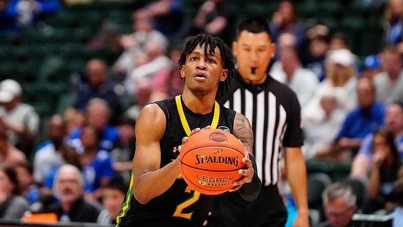 Nov 27, 2022; Orlando, FL, USA; Siena Saints guard Javian McCollum (2) shoots against the Seton Hall Pirates during the second half at ESPN Wide World of Sports. Mandatory Credit: Rich Storry-USA TODAY Sports