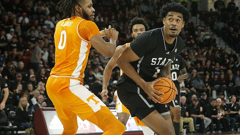 Jan 17, 2023; Starkville, Mississippi, USA; Mississippi State Bulldogs forward Tolu Smith (1) spins toward the basket as Tennessee Volunteers forward Jonas Aidoo (0) defends during the second half at Humphrey Coliseum. Mandatory Credit: Petre Thomas-USA TODAY Sports