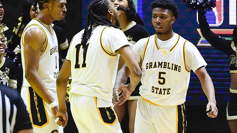 Feb 18, 2023; Salt Lake City, Utah, USA; Grambling State University Tigers forward Jourdan Smith (11) celebrates after a basket by guard Tra'Michael Moton (5) against the Southern University Jaguars during overtime at the Jon M. Huntsman Center. Mandatory Credit: Christopher Creveling-USA TODAY Sports