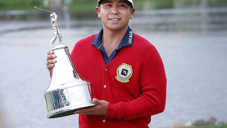 Mar 5, 2023; Orlando, Florida, USA;  Kurt Kitayama holds the champions trophy after winning the Arnold Palmer Invitational golf tournament. Mandatory Credit: Reinhold Matay-USA TODAY Sports