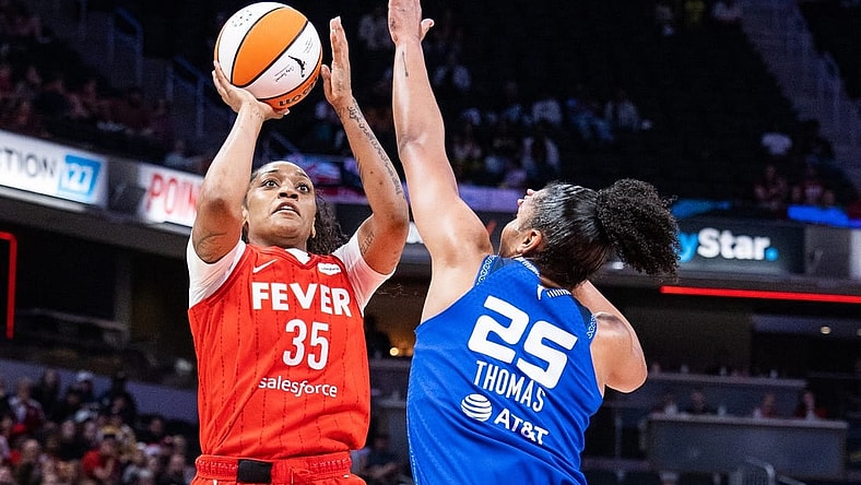 May 19, 2023; Indianapolis, Indiana, USA; Indiana Fever guard Victoria Vivians (35) shoots the ball while Connecticut Sun forward Alyssa Thomas (25) defends in the second half at Gainbridge Fieldhouse. Mandatory Credit: Trevor Ruszkowski-USA TODAY Sports