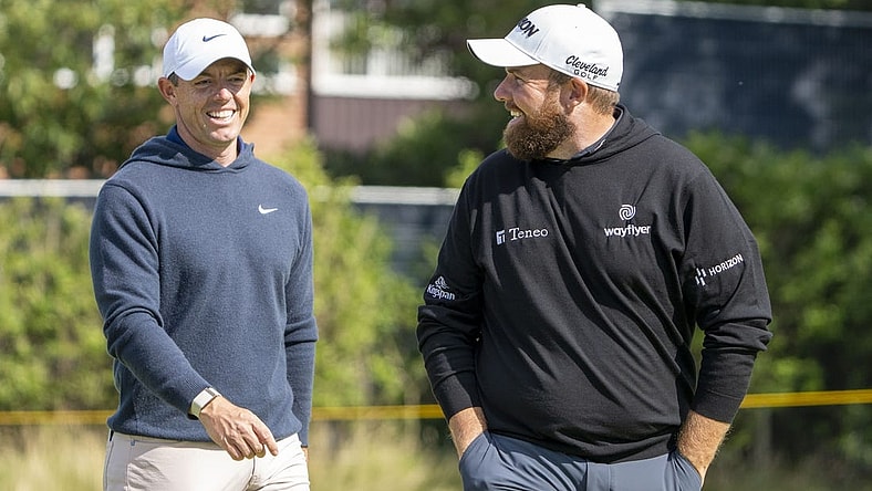 July 17, 2023; Hoylake, ENGLAND, GBR; Rory McIlroy (left) and Shane Lowry (right) smile on the fourth hole during a practice round of The Open Championship golf tournament at Royal Liverpool. Mandatory Credit: Kyle Terada-USA TODAY Sports