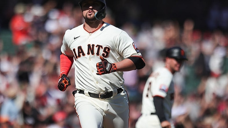 Sep 13, 2023; San Francisco, California, USA; San Francisco Giants third baseman J.D. Davis (7) reacts after hitting a three run home run during the eighth inning against the Cleveland Guardians at Oracle Park. Mandatory Credit: Sergio Estrada-USA TODAY Sports