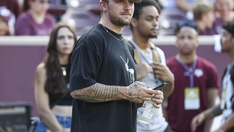 Sep 16, 2023; College Station, Texas, USA; Former Texas A&M Aggies player Johnny Manziel watches from the sideline during the first half of the game between the Aggies and the Louisiana Monroe Warhawks at Kyle Field. Mandatory Credit: Troy Taormina-USA TODAY Sports