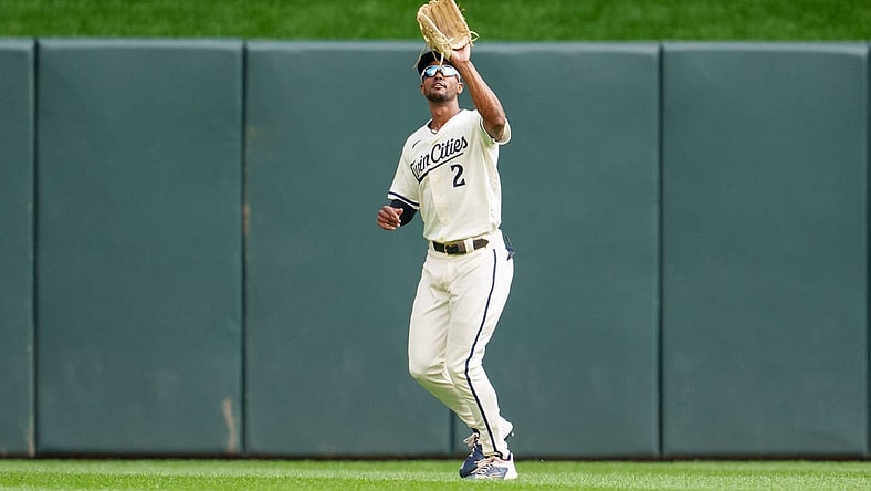 Sep 24, 2023; Minneapolis, Minnesota, USA; Minnesota Twins center fielder Michael A. Taylor (2) catches a ball to retire Los Angeles Angels catcher Logan O'Hoppe (14) in the second inning at Target Field. Mandatory Credit: Matt Blewett-USA TODAY Sports