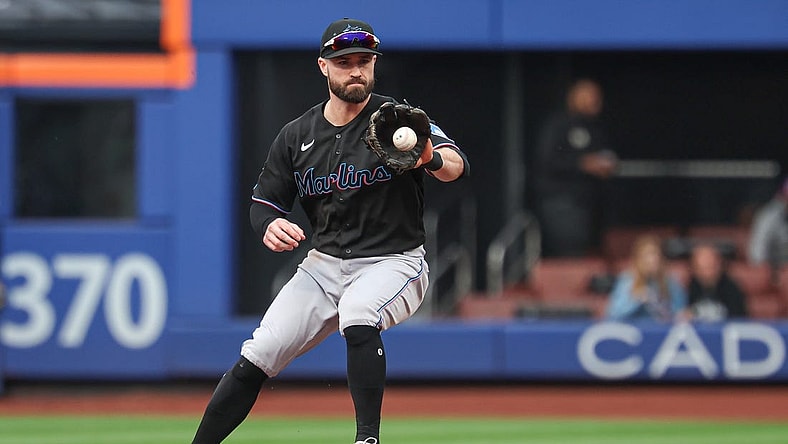 Sep 27, 2023; New York City, New York, USA; Miami Marlins shortstop Jon Berti (5) fields he ball during the third inning against the New York Mets at Citi Field. Mandatory Credit: Vincent Carchietta-USA TODAY Sports